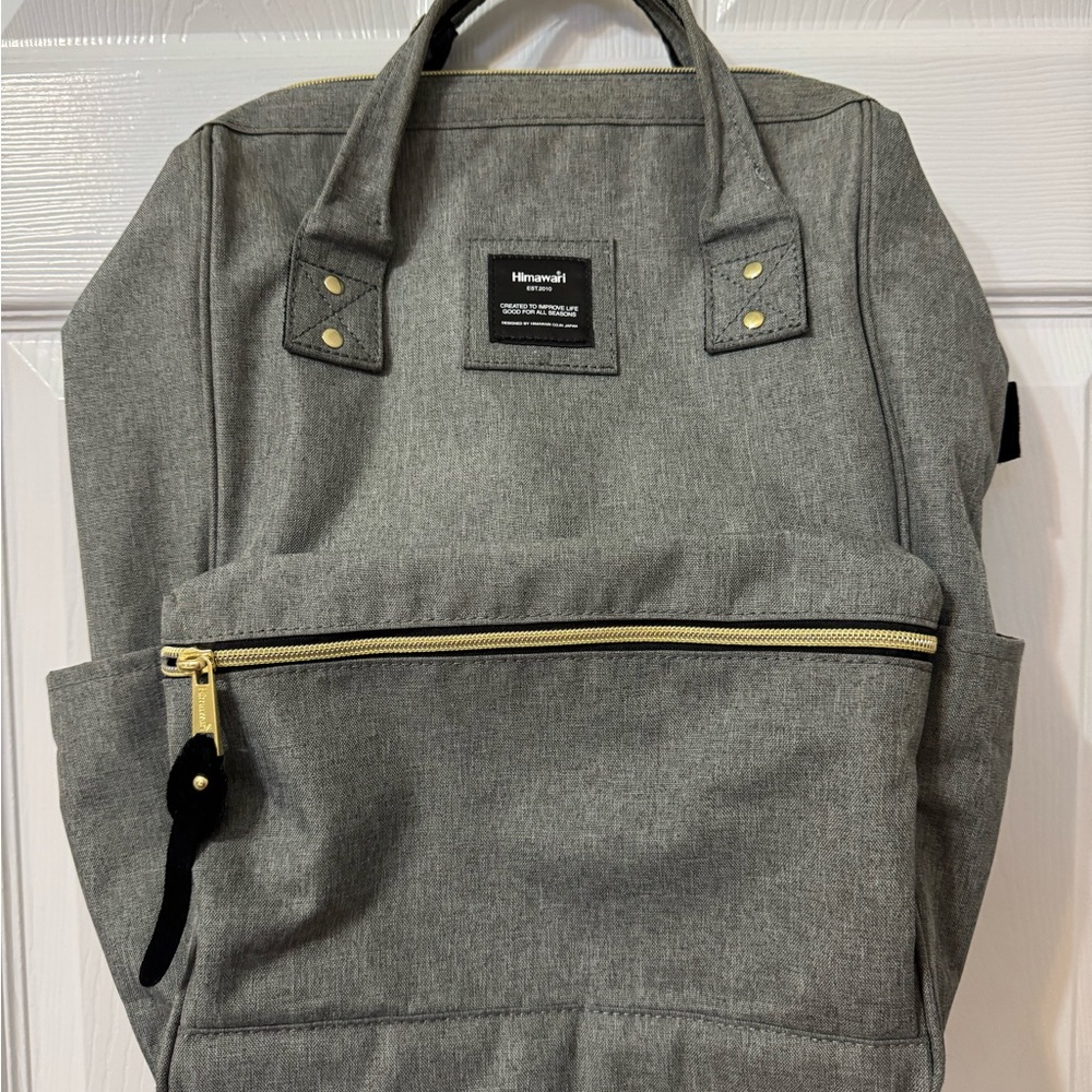 Herschel Gray Backpack with Gold Accents